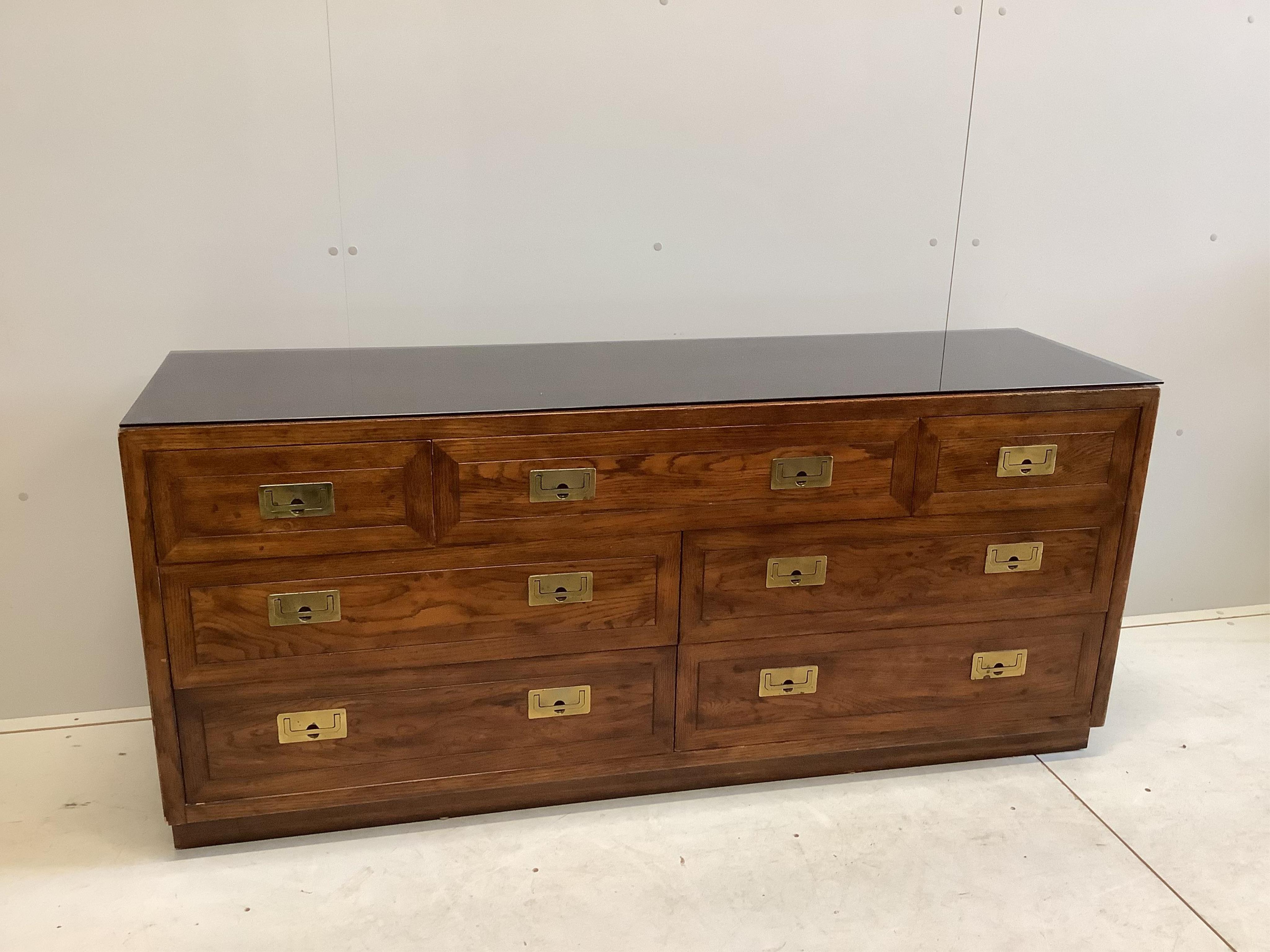 A Chinese style brass mounted elm low sideboard, width 162cm, depth 46cm, height 72cm. Condition - fair to good